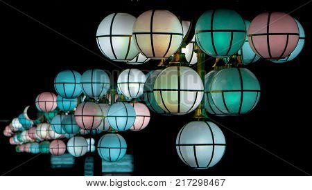 The street lamp in the form of bunches of different colors of round form.