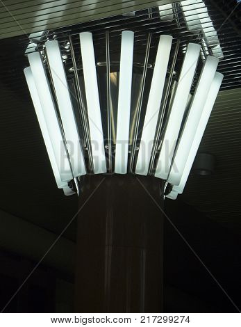 Rectangular lights on a granite column, in a circle,