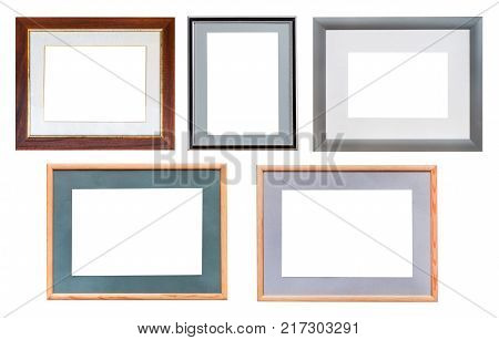 set of various wide wooden picture frames with cut out canvas isolated on white background
