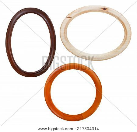 set of round wooden picture frames with cut out canvas isolated on white background