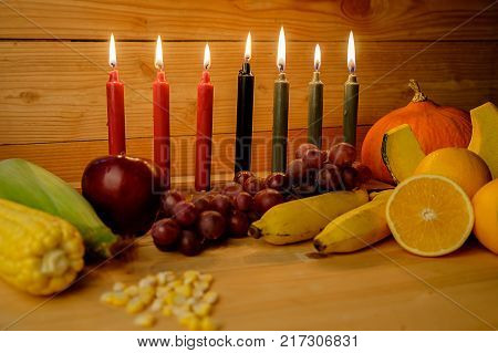 Kwanzaa Holiday Concept With Decorate Seven Candles Red, Black And Green, Gift Box, Pumpkin,corn And