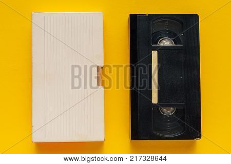 Blank used video casette tape retro technology. Video home system (VHS) recording tape with blank warapper as copy space.