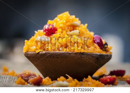 Indian Sweet Rice Dish In A Clay Bowl On Gunny Background.