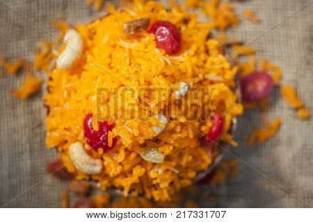 Indian Sweet Rice Dish In A Clay Bowl On Gunny Background.