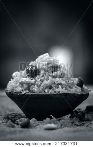 Indian Sweet Rice Dish In A Clay Bowl On Gunny Background.