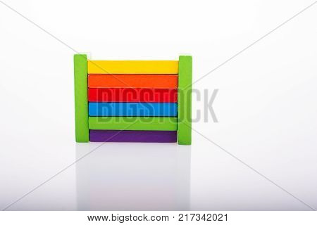 Colorful Domino Blocks in a line on a white background