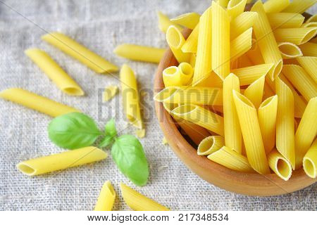 Penne rigate. Macaroni in the form of feathers. mostaccioli pasta