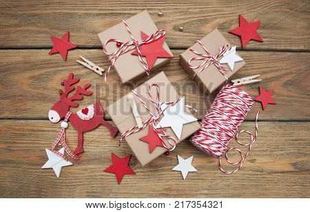 Christmas gift boxes and decorations on wooden background