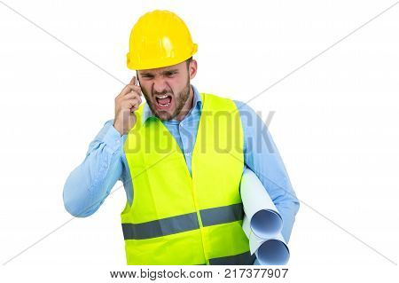 Angry upset young construction engineer yeling at the phone.