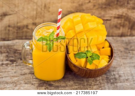 Mango Fruit And Mango Cubes On The Wooden Table