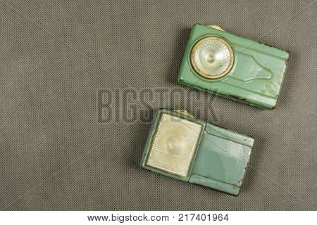 A collection of two vintage retro flashlights.
