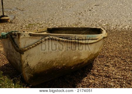Dingy Boat At Low Tide