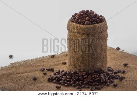 Coffee in a bag of deregie, on a yellow thick fabric.