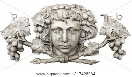 Face and grapes carved in marble isolated on white background