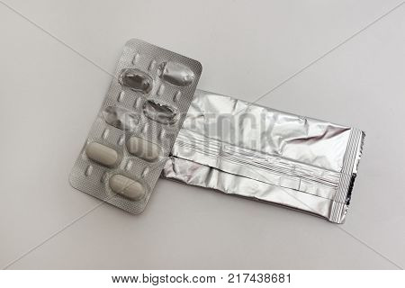 pills plate, pulled out from the aluminum slipcover