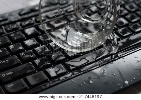 Liquid spilled on a computer keyboard close-up