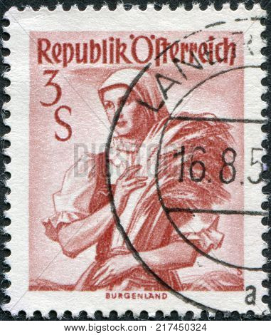 AUSTRIA - CIRCA 1949: A stamp printed in Austria shows a woman in national dress Burgenland circa 1949