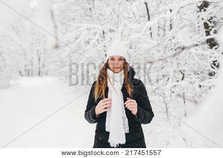 Beautiful Young Girl In A White Winter Forest