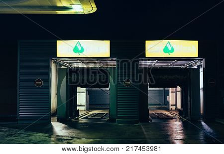 STRASBOURG FRANCE - NOV 29 2017: AGIP Gas station in France at night with Car Wash entrance for the automatic car cleaner