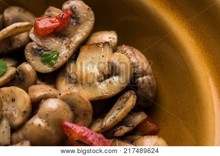 Mushroom Fry or sauteed mushroom or masharoom served in a bowl or in a frying pan over colourful background
