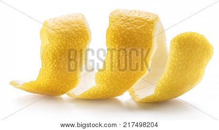 Lemon peel or lemon twist on white background. Close-up.