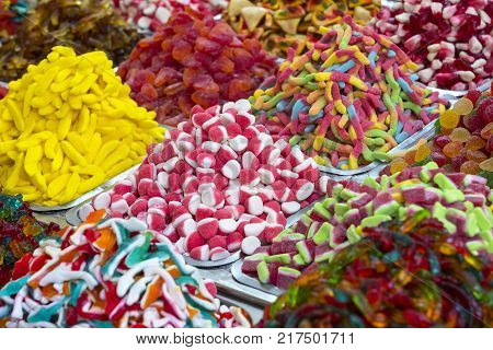 Assortment of jellied colored sweets as a product background