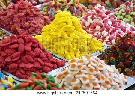 Assortment of jellied colored sweets as a product background