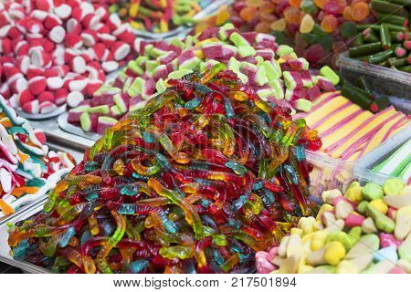 Assortment of jellied colored sweets as a product background