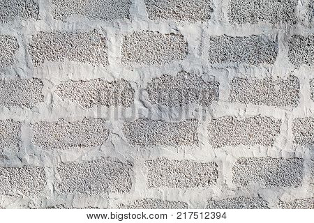 The Wall Of Cinder Blocks Is Painted White. Background Texture
