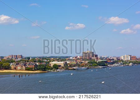 A view on old town Alexandria from the river Virginia USA. Potomac River panorama in early autumn.