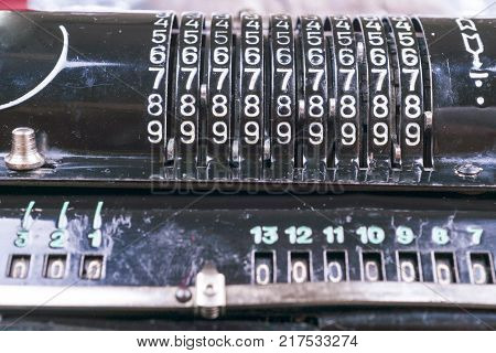 Old Rusty Retro Calculator Black Standing On A Wooden Table