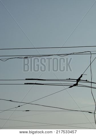 wires pole with blue sky. electrical wires on a background. electric cables. power cable with blue sky. Transmission Line cables. Electric wire in the sky backdrop. Electric wire isolated background.
