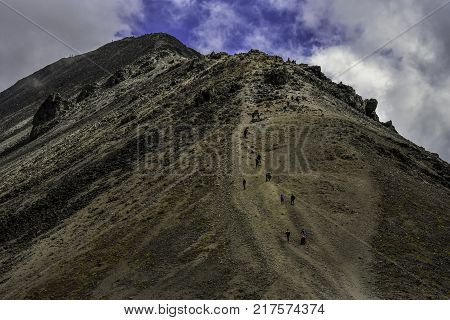 People walking Volcano Nevada de Toluca with lakes inside crater in Mexico