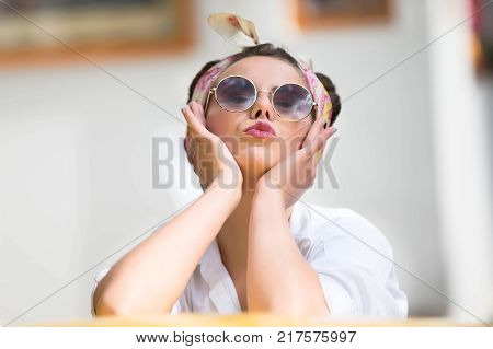 Russia Moscow Izmaylovsky Park August 27 2017. International Photo Festival.Portrait of a model in the style of the sixties