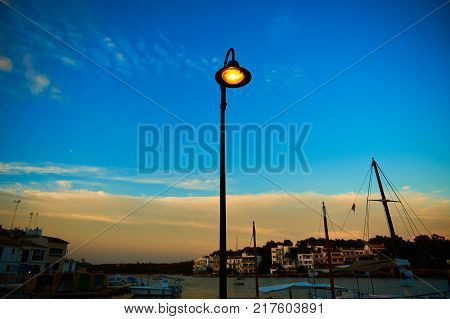 Single street lamp in a small european seaport town