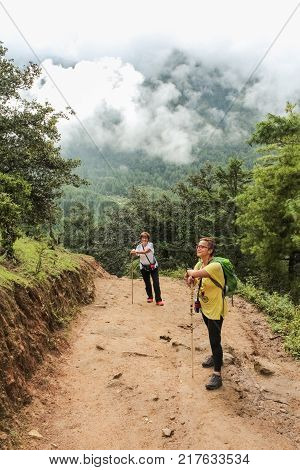 Paro, Bhutan - September 18, 2016: Two Tourist Women Hiking On The Way To Taktshang Palphug Monaster