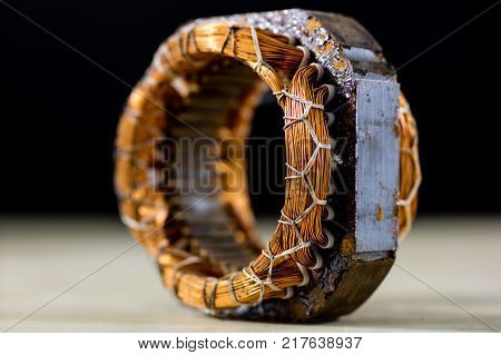 Parts For An Electric Motor On A Wooden Table. Stator Of The Engine On A Wooden Workshop Table.
