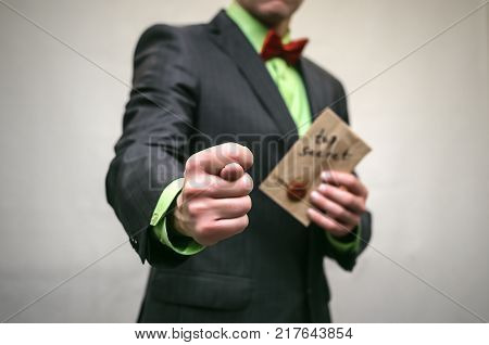 The spy. Secret service. Detecive agent holds pistol gun in his hands and secret documents with compromising evidence behind his back. Secret meeting. Retro gangster isolated.