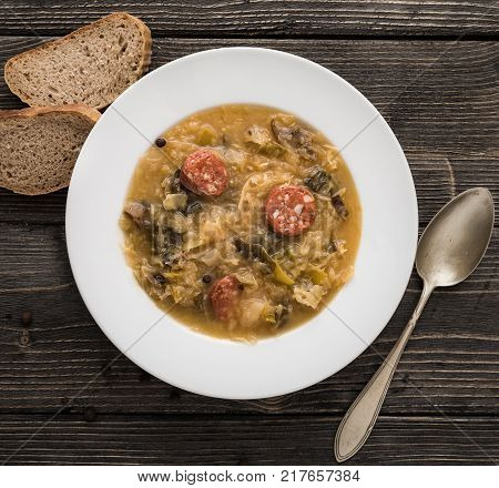 Slovak christmas cabbage soup with mushrooms on natural background.