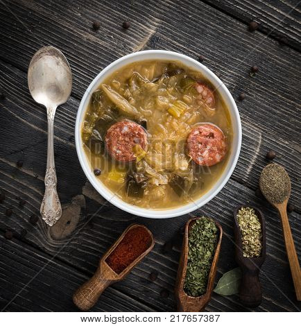 Slovak christmas cabbage soup with mushrooms on natural background.