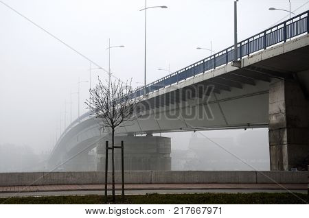 the bridge over the river that goes into the fog