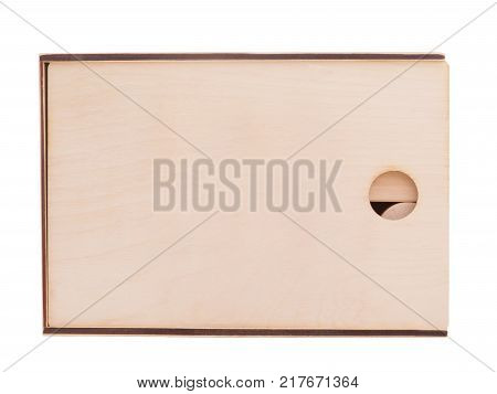 Wooden closed, square box, for children's geometric shapes, with a round hole, stands in a horizontal position, isolated on a white background.