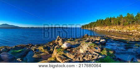 Scenic panoramic view of the ocean overlooking at the Strait of Georgia from Jack Point and Biggs Park in Nanaimo, British Columbia.