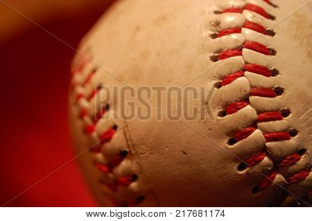 Macro shot of the stitching on a baseball.