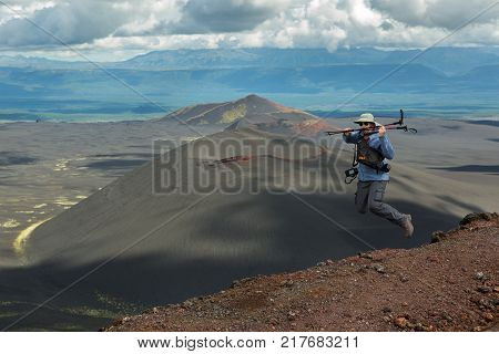 Kamchatka Peninsula, Russia - August 20, 2016: Tourist at the top of Hiking trail climb to the North Breakthrough Great Tolbachik Fissure Eruption 1975
