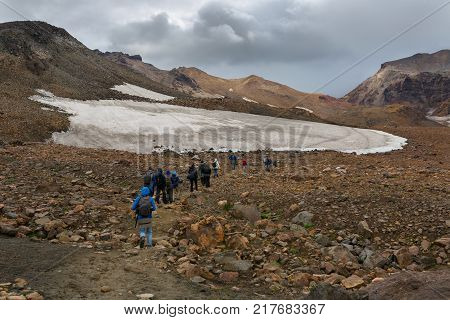 Kamchatka Peninsula, Russia - August 26, 2016: Tourists during the ascent to the active volcano Mutnovsky in Kamchatka.