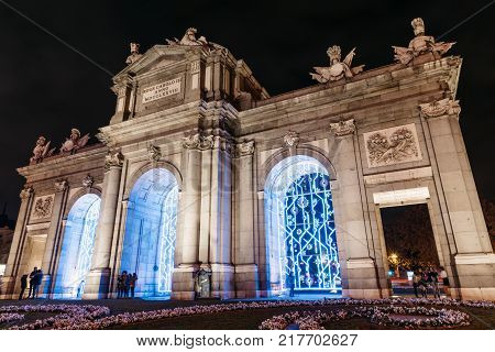 Madrid, Spain - December 8, 2017: Puerta of Alcala in Madrid at night on Christmas time.