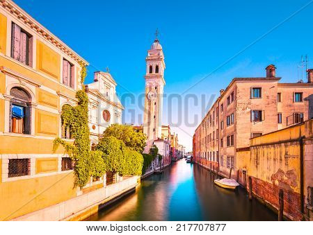 Venice sunset cityscape San Giorgio dei Greci water canal and church campanile. Italy Europe.