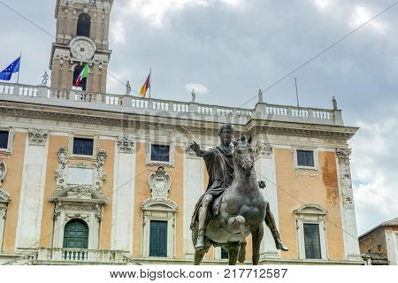 the bronze equestrian statue of Marco Aurelio (Marcus Aurelius) with the Campidoglio Palace in the distance in Rome