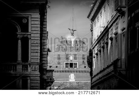 Rome Italy February 2017: facade of the Castel of the Holy Angel (Castel Sant Angelo) seen through the medieval roman alleys